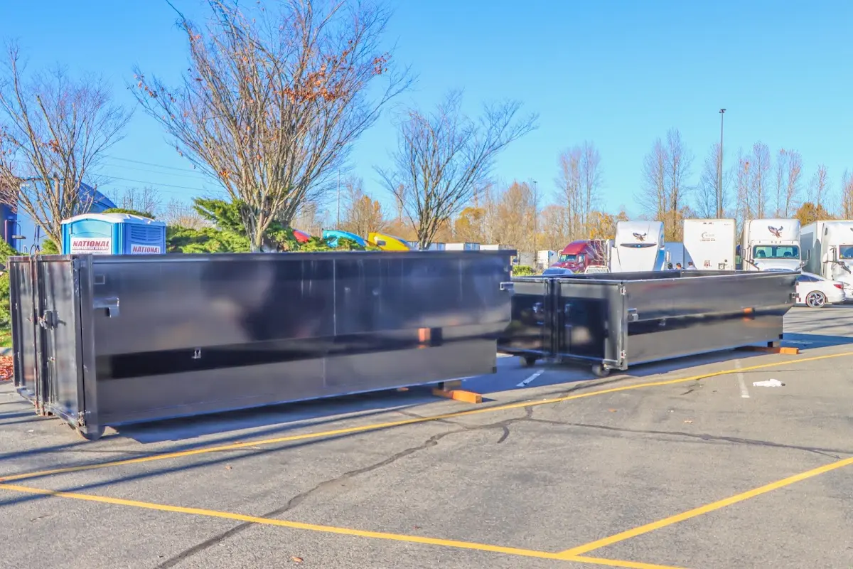 Professional dumpster rental service with roll-off container on residential driveway in Christiana